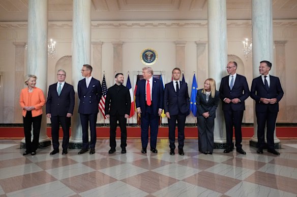 The delegation of European leaders pose with Trump at the White House.