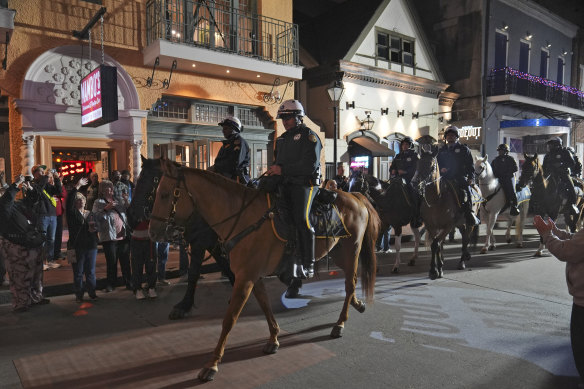 Mounted police patrol Bourbon Street.