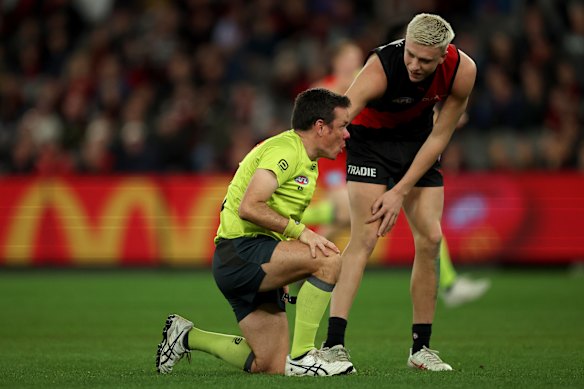 Nate Caddy and umpire Robert O’Gorman made contact in a week when the AFL announced a crackdown.