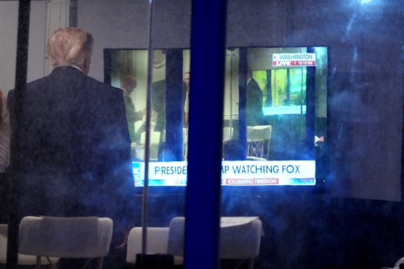 President Donald Trump watches himself on screen as he waits to speak at an Independence Day event honouring the nation’s 250th anniversary, on July 4.