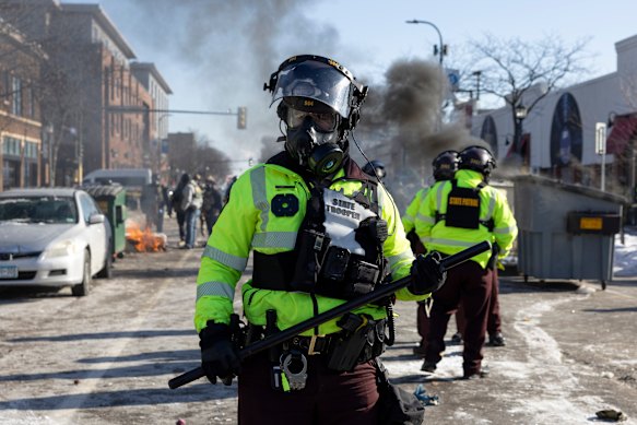 A Minnesota State Trooper wears riot gear.