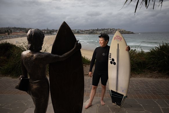  Surfer Pauline Menczer with her statue at the southern end of Bondi Beach.