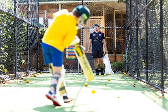 Hamish Reynolds of Cricket Insight Academy in North Sydney training kids in North Sydney.