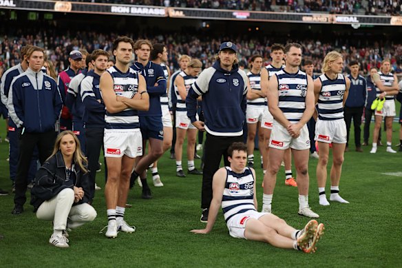 Bruhn (far left) with his Geelong teammates on the ground after the team’s grand final loss in September.