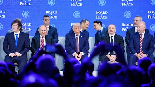 President Trump sits on the podium during a session on the Board of Peace initiative of US President Donald Trump at the Annual Meeting of the World Economic Forum in Davos, Switzerland, Thursday, Jan. 22, 2026. (AP Photo/Markus Schreiber)
