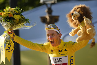 Tadej Pogacar celebrates his overall victory in last year's Tour de France, his second victory in a row.