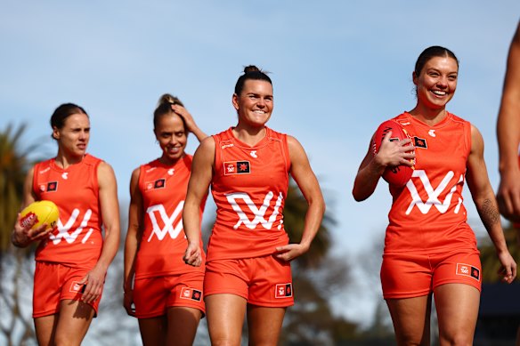 Jasmine Garner, Kaitlyn Ashmore, Lily Mithen and Ellie Blackburn celebrate the 2025 AFLW Season Launch at Ikon Park. 