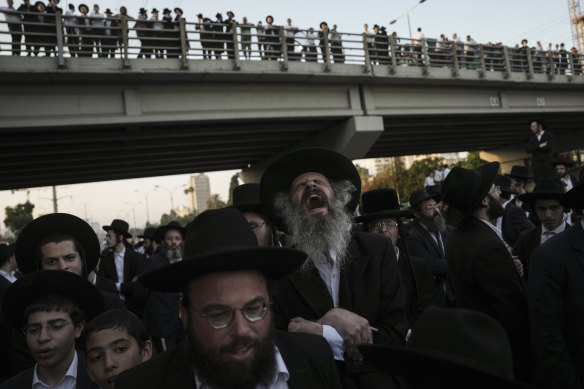 Ultra-Orthodox Jewish men artifact  a road  during a protestation  against service  recruitment successful  Bnei Brak, Israel.