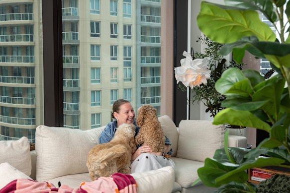 Jo Williams with her cavoodles Cooper and Rosie at the award-winning Indi Sydney apartment.