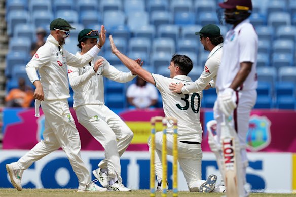 Australia’s captain Pat Cummins celebrates after taking a return catch to dismiss West Indies’ Keacy Carty. 