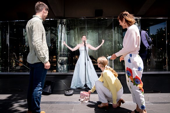 Opera-singing busker Lucy Diggerson, who wears her mother’s wedding dress while performing in the St Kilda Road arts precinct.