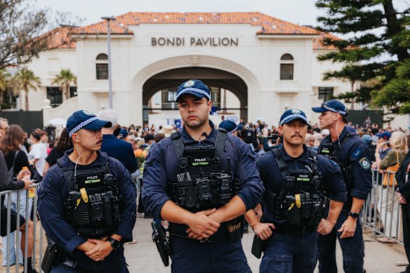 Police at Bondi Pavilion  at the memorial for shooting victims.