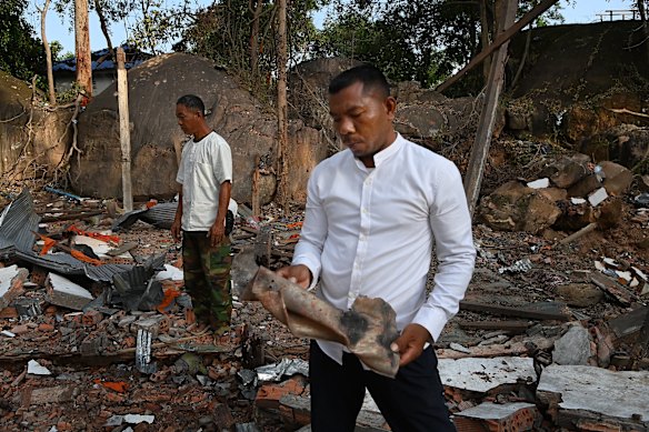 Teuk Buntoeun stands among the ruins of what was a dormitory for monks and temple workers, at the Ta Moan Sen Chet Pagoda. 
