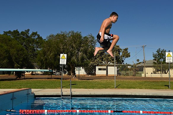 Ace Bell, 10, dives into the Peak Hill War Memorial pool as temperatures hovered in the mid-30s.