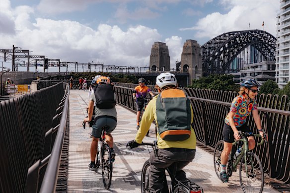 Cyclists try out the new 170-metre-long ramp at the northern end of the Harbour Bridge for the first time on Tuesday.