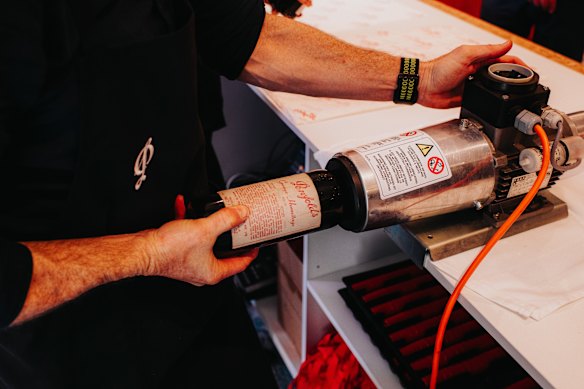 After a wine is assessed and approved for certification, it is recorked and recapsuled.