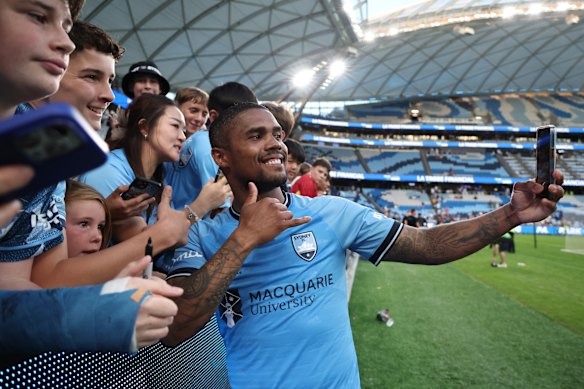 Douglas Costa with fans at a Sydney FC game at Allianz Stadium in April.
