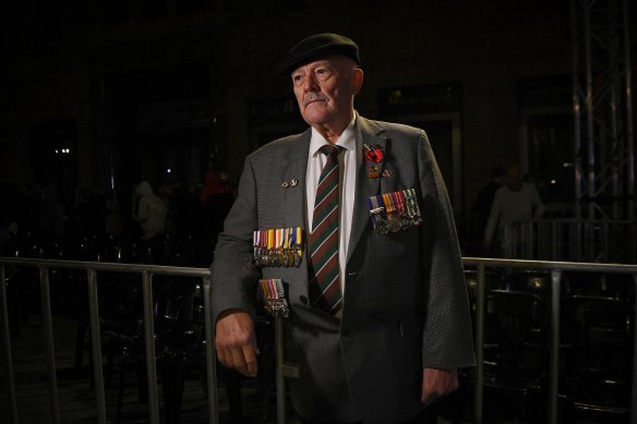 Vietnam seasoned  Bob Dean, wearing his work  medals and his begetter  and grandfather’s medals, astatine  the Anzac Day dawn work  successful  Martin Place.