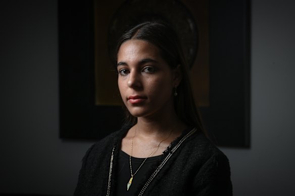 Zaina Amro wearing her Palestine pendant necklace.