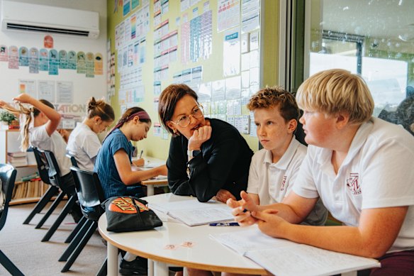 Students listen to high school teacher Sarah Peachman, head teacher of English at Freshwater Senior Campus.
