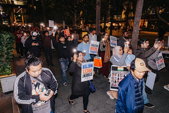Protesters march through Parramatta Square.