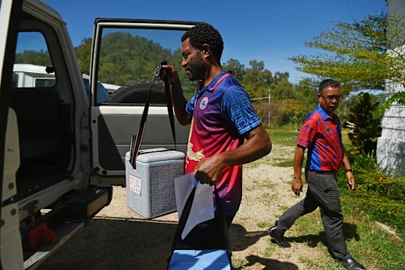 Puana loads the vaccines ready to transport to Papa Health Centre in Central Province, PNG.