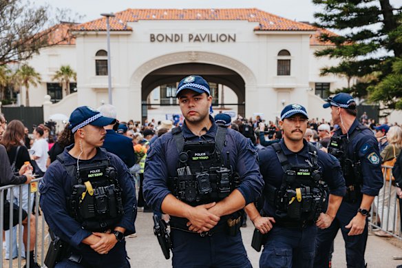 Police at the memorial at Bondi Pavilion.