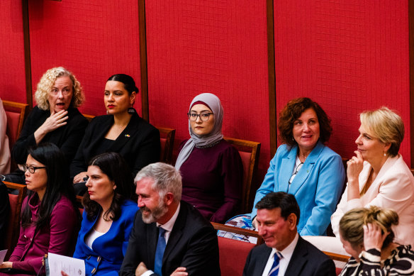 Senator Fatima Payman (centre) sits among the Labor caucus during the swearing-in of Governor-General Sam Mostyn yesterday.