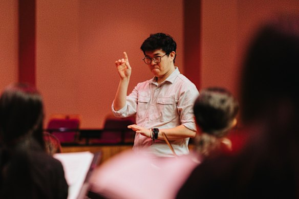 artists Fill-in choirmaster Zikang Zhan asks students to do it again, but in a different colour.