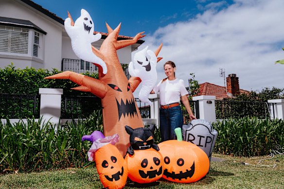 CostumeBox founder and chief executive Nikki Yeaman outside her home in Balgowlah Heights with Halloween inflatables.