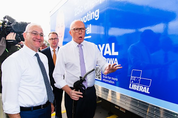 Liberal candidate for Werriwa Sam Kayal and Peter Dutton preparing to fill up the campaign truck on Tuesday morning.
