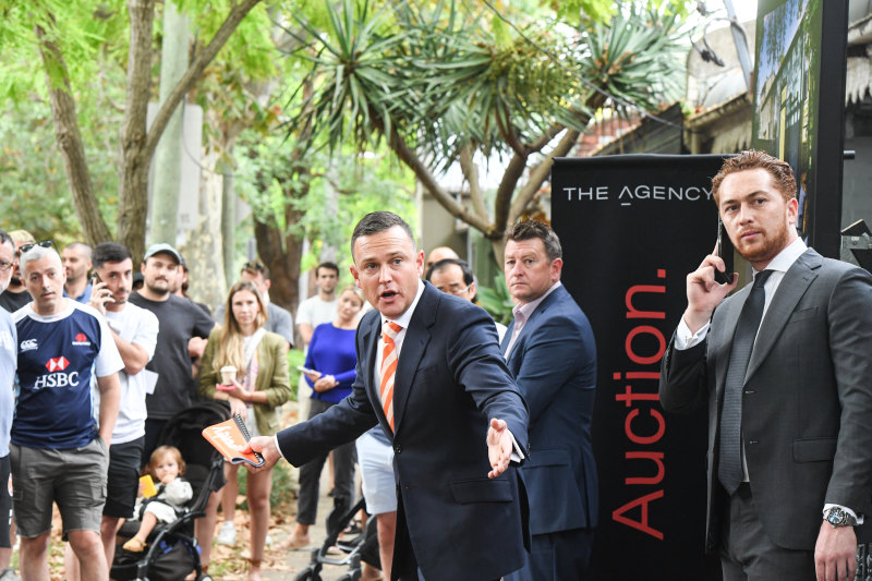 A large crowd gathered to watch the Redfern terrace go under the hammer.