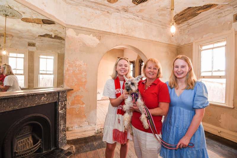 First home buyers Lucinda and Maddi, and their mum Cath, and pet dog Tiffany, teamed up to purchase the Neutral Bay home.