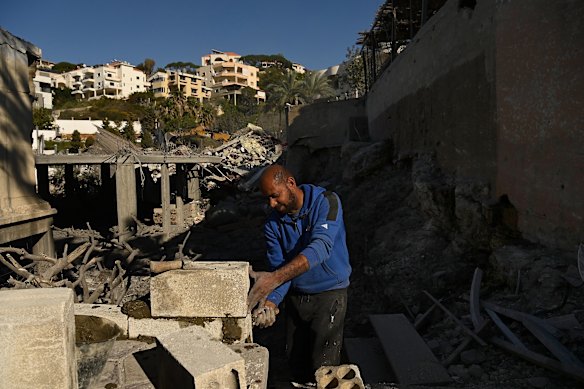 A labourer repairs the Nassars&rsquo; home.