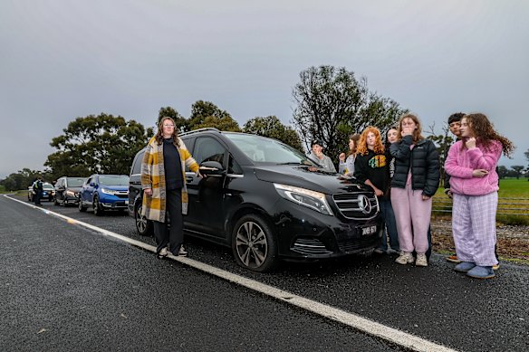 Rachel Welsh with her car and passengers that suffered a flat tyre, along with four other vehicles, after hitting a large pothole on the Hume Highway north of Seymour.