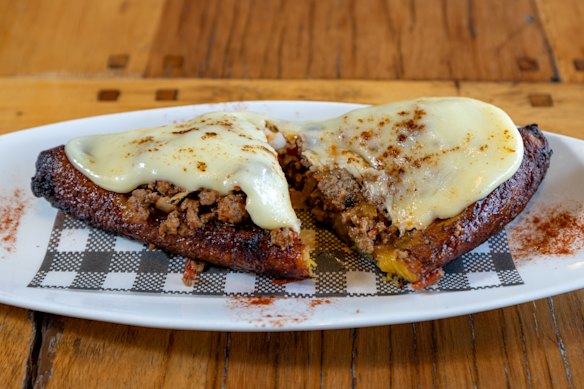 Grilled plantain topped with minced beef and cheese, it's like a jacket potato with buttery roasted banana as the base. 
