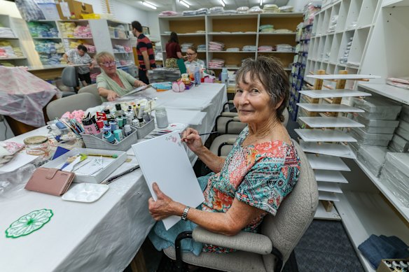 Jean Kroese embellishing an Angle Box. Volunteers from the Treasured Babies group make tiny clothes, doonas, teddy bears and box liners and paint “angel boxes” that can be used as memento boxes for grieving relatives of babies who have died from conditions such as stillbirth, miscarriage and SIDS.
