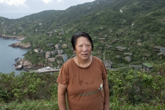 Cai Yaqin, 69, the last villager to leave Houtouwan village. 