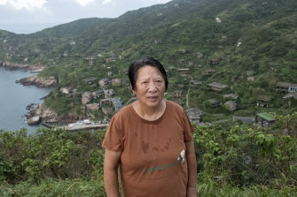 Cai Yaqin, 69 ans, le dernier villageois à avoir quitté le village de Houtouwan. 