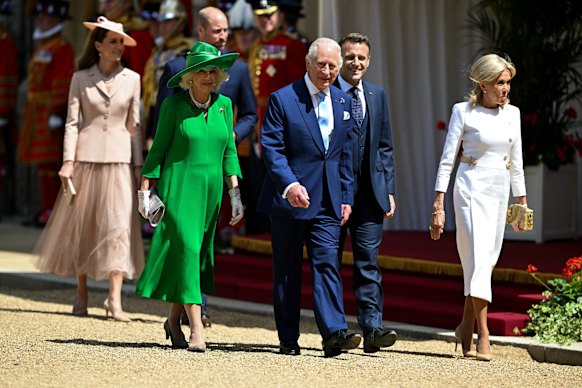 Catherine – pictured with the King and Queen, the Macrons and Prince William –   showcased updated versions of two of Dior’s signature designs – the Bar jacket and the romantic tulle skirt.