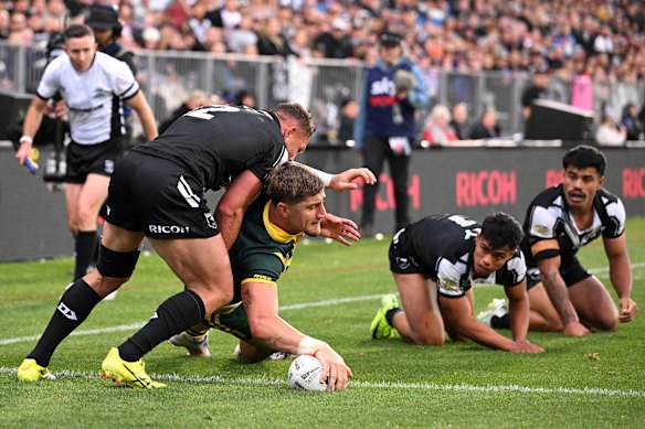 Zac Lomax scores a try for Australa in 2024.