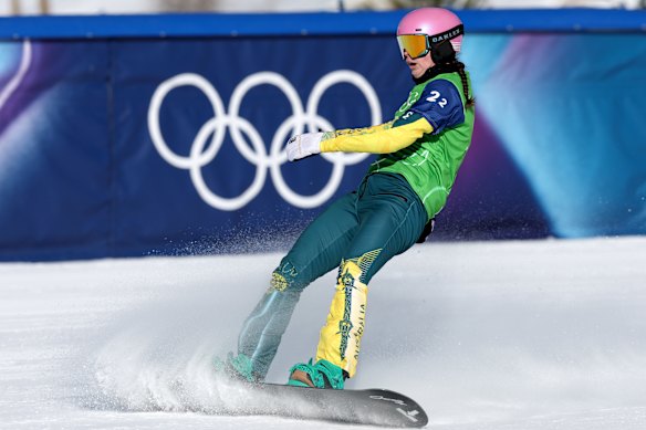 Josie Baff crosses the line last in the mixed snowboard cross final.