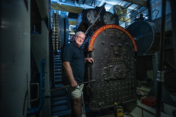  Rohan Burgess with the wood-fired steam engine that will propel the Australian Star paddle steamer.
