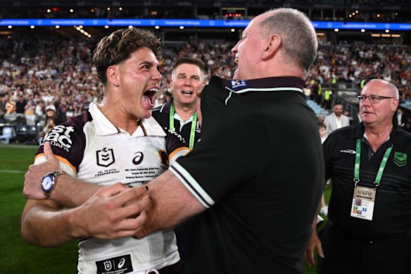 Reece Walsh and coach Michael Maguire celebrate on Sunday night.