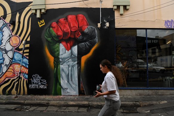A mural in the colours of the Palestinian flag on the wall of Cairo Takeaway restaurant in Enmore.