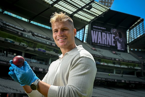 Jason Warne holds “the Gatting ball” bowled by his Dad.