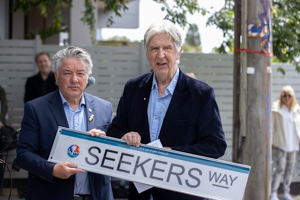 The Seekers’ Bruce Woodley is presented with a replica of the street sign by City of Port Phillip councillor Serge Thomann.