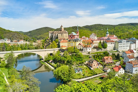 A panoramic view of picturesque Loket castle and the bridge that spans the river Ohri  in the Czech Republic. 
