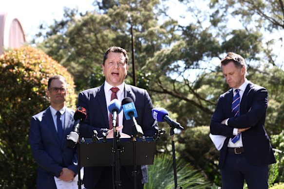 Developer Walker says its development in Appin was delayed due to an intervention by Planning Minister Paul Scully (centre).