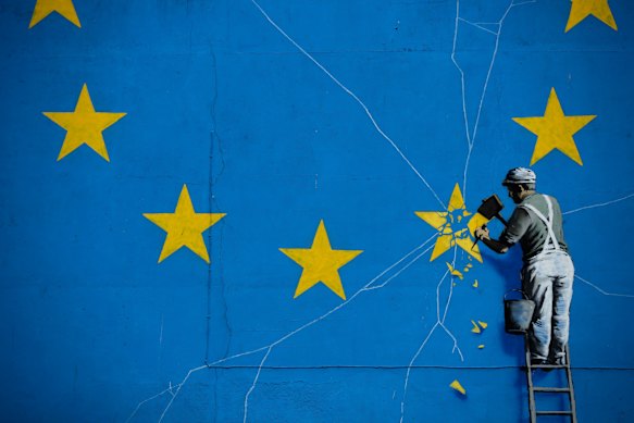 A mural by street artist Banksy near the Dover ferry port shows an EU star being chiselled away from the flag.